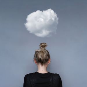 Woman standing under cloud